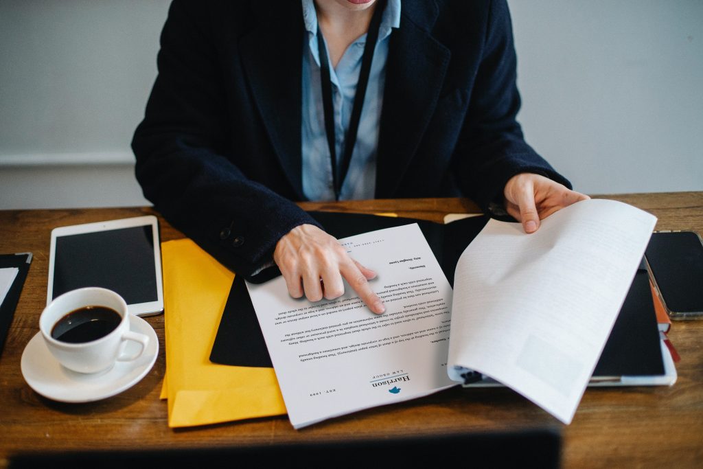 Image of woman reading contract of employment